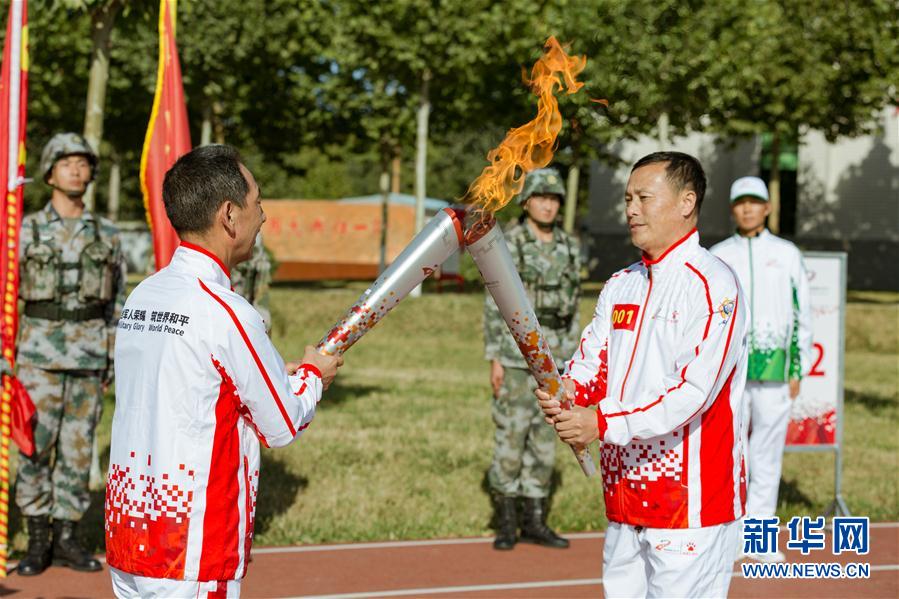 “第七届世界军人运动会火炬传递活动第二站在“开国大典红一师”举行