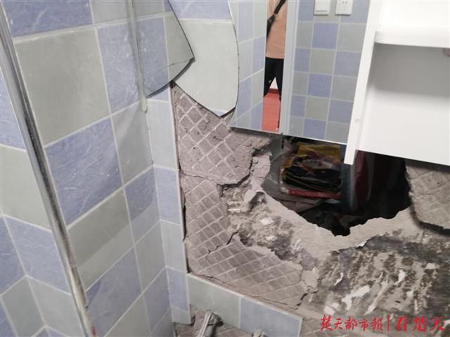 |起诉开发商讨要“缩水”的2.5平米未果，女业主雇人砸破邻居家墙壁