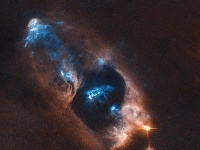 哈勃望远镜捕捉到新生恒星 呈亮蓝色距地球约1000光年