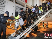 “蓝天行动” 破获系列社交电信网络诈骗案 57名犯罪嫌疑人被押解回上海